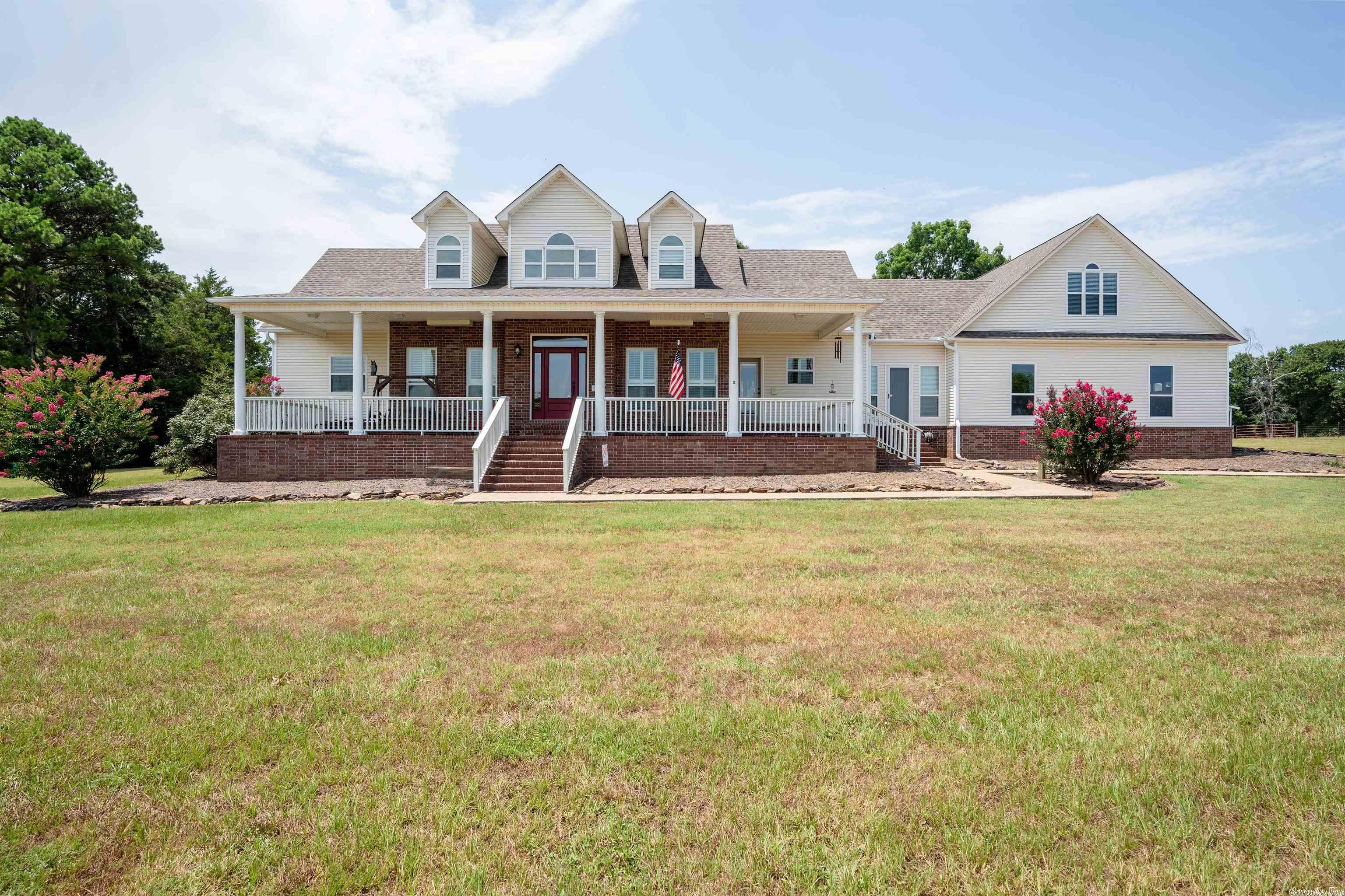One owner home w/40 acres & gated entrance. 16 mi to Greers Ferry Lake. The main floor offers primary bedroom w/ensuite, guest bedroom w/bath, great room w/high ceilings, DR, kitchen, brkf nook, 1/2 ba, office & laundry. Upper level has 2 bedrooms, 1 ba, large bonus room & floored attic space. 3 car garage with a storm cellar inside. 2-50 Amp services outside & prepped for generator. New roof installed in 2015 rated at 120 MPH winds. Water heater 5 yrs. Property is cross fenced, has 2 barns & stocked pond.