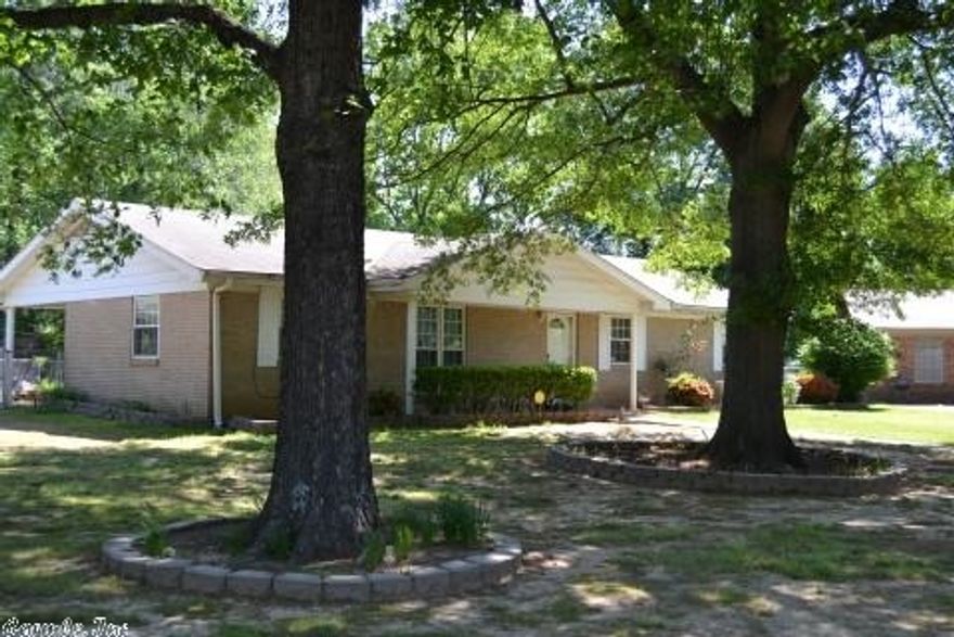 Beautiful brick, all electric, 3 bedroom, 2 bath, house in great location near airbase, shopping, and freeway. New carpet, tile, and paint. Eat in kitchen, formal dining room, den, and 17 x 18 sunroom heated & cooled. Master bedroom separate from other 2 bedrooms. Window treatments and refrigerator stay. Insulated windows & doors for energy conservation. Chain link fenced back yard, large 16 x 20 workshop w/ electricity & work tables. Large shady corner lot on cul-de-sac.