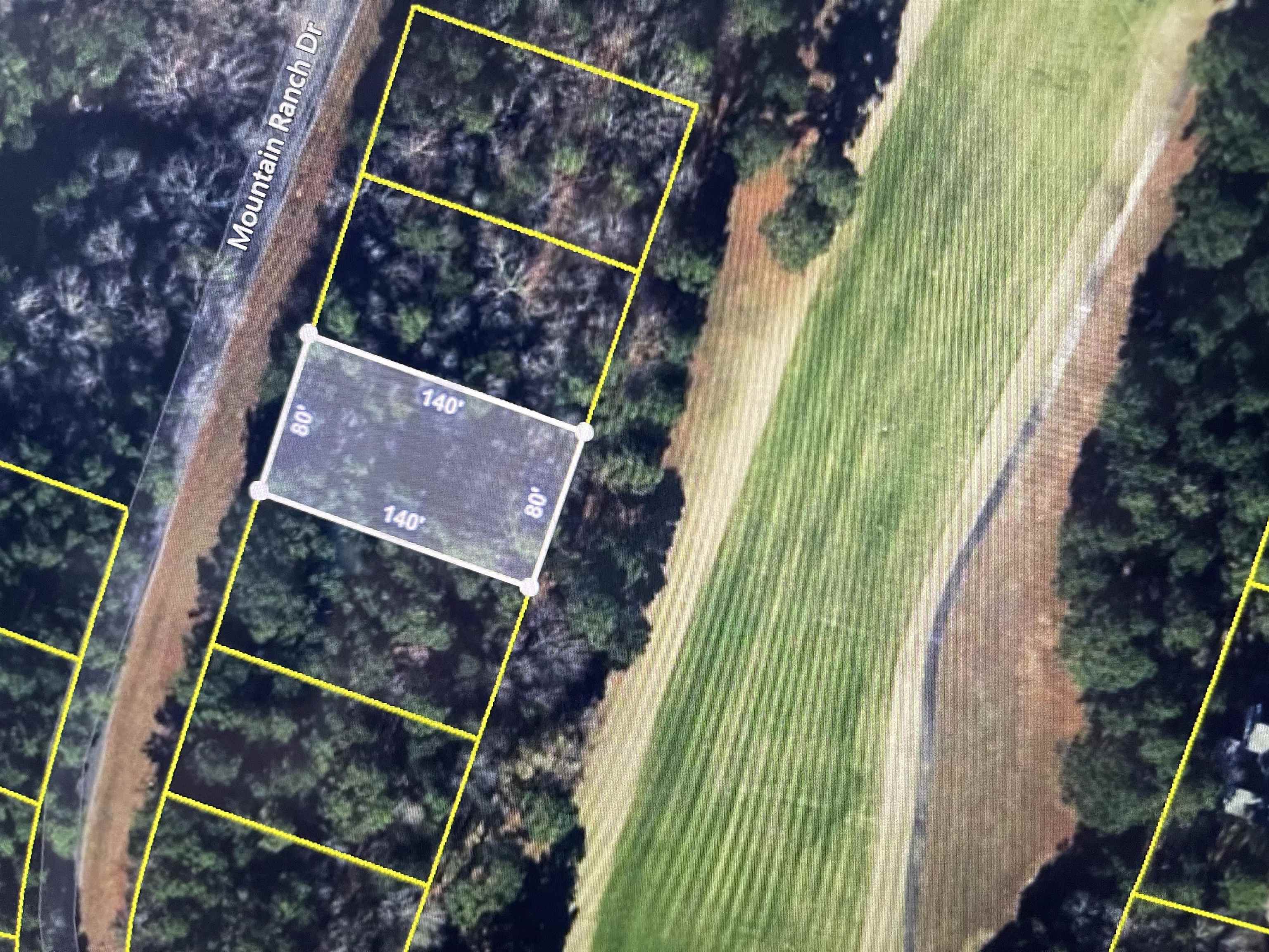 Come build your dream home today on the golf course frontage lot. Enjoy living in Fairfield Bay, where every day feels like a vacation! Nestled amidst the picturesque landscapes of the Mountain Ranch Golf Course, this area offers you the perfect blend of relaxation & adventure. With this prime location, you can indulge in your passion for golf anytime you desire. Tee off during the day & as the sun sets, bask in the breathtaking views of the shimmering lake nearby. This is the epitome of tranquil living at its finest. But that's not all! Fairfield Bay boasts a plethora of amenities to enrich your life. Within minutes of your new abode, you'll find a full-service marina, beckoning you to embark on aquatic adventures whenever the mood strikes. Dive into the refreshing waters of one of the three swimming pools, or challenge your friends to a game of tennis or pickleball. Feel the thrill of exploration as you traverse the hiking & biking trails, or opt for a leisurely round of miniature golf or disc golf. With over 80 miles of UTV trails at your disposal, the possibilities for outdoor recreation are endless. Buyer to pay all closing costs and title insurance.