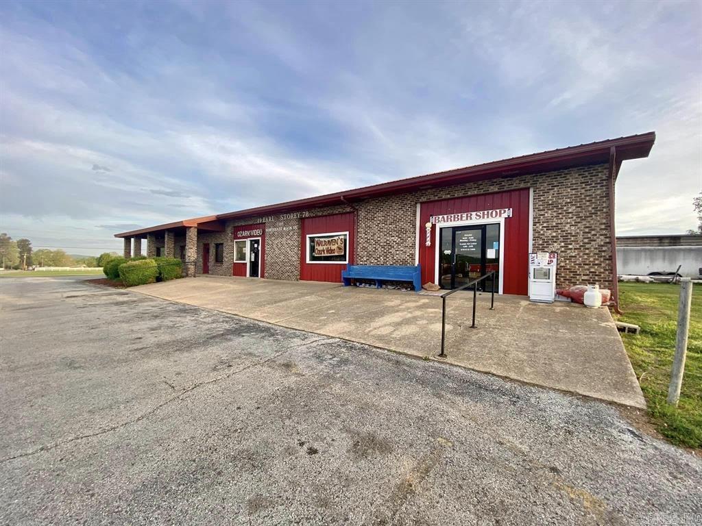 Commercial building with paved parking lot and Main Highway frontage with heavy traffic... Turn-key ready for you to invest or use as your own office space. There are 3 different rentals and all 3 are currently rented. New metal on roof was installed in 2023