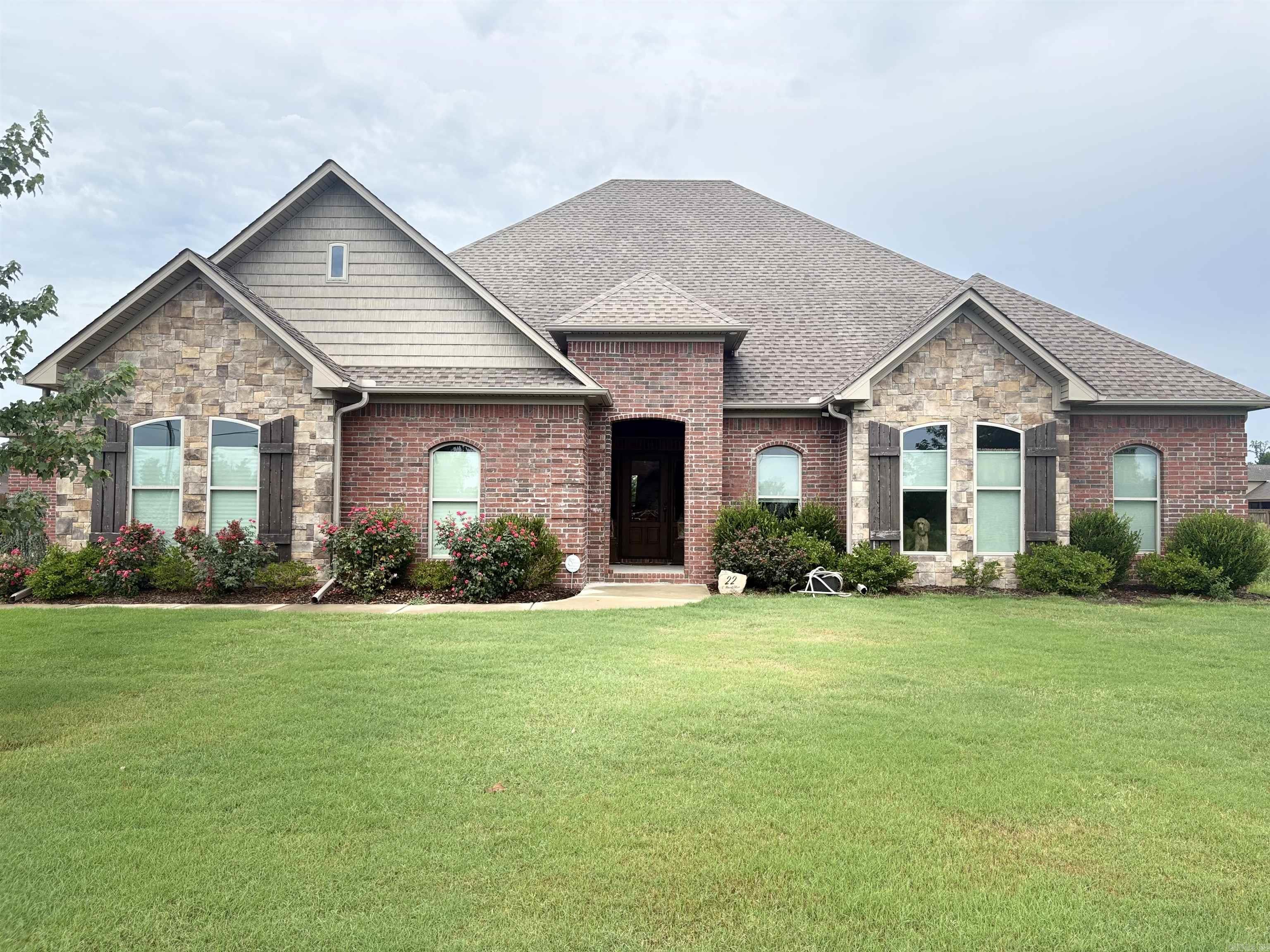 This gorgeous home will not disappoint! It is absolutely beautiful inside and out! From the entrance to the backyard, you will feel at home in this spacious home featuring a welcoming open family room with gas fireplace, and 12 ft. ceilings, a kitchen that will make everyone want to cook, a bar roomy enough for six seats, and a great dining area! This 3 BR home also has an office, 4 car garage and safe room. The covered patio has a gas fireplace and opens to a beautiful fenced yard!