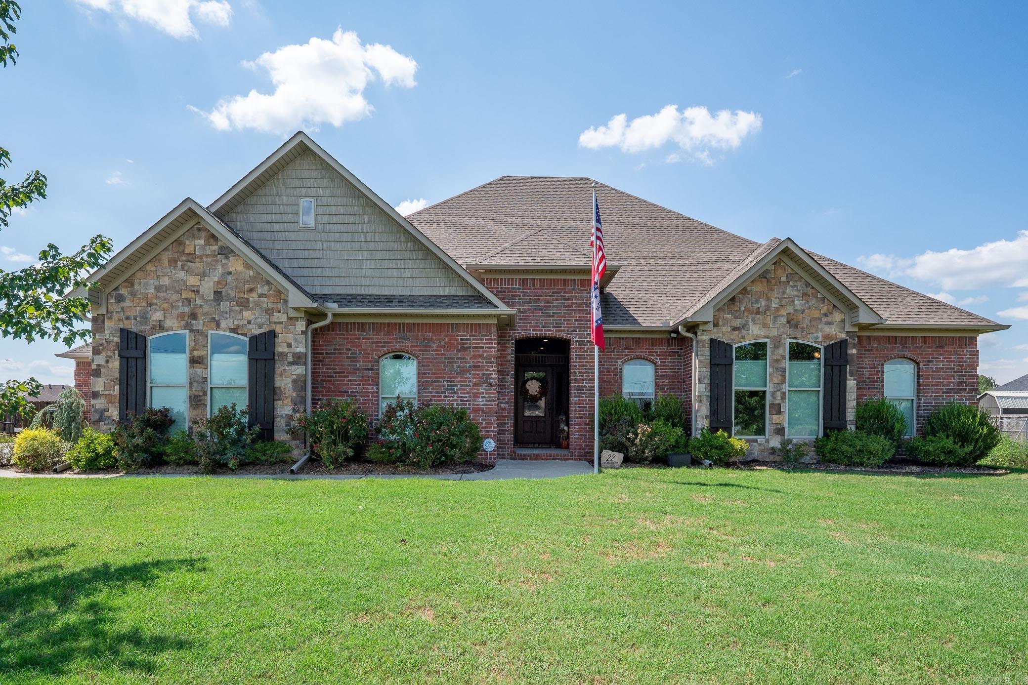 This gorgeous home will not disappoint! It is absolutely beautiful inside and out! From the entrance to the backyard, you will feel at home in this spacious home featuring a welcoming open family room with gas fireplace, and 12 ft. ceilings, a kitchen that will make everyone want to cook, a bar roomy enough for six seats, and a great dining area! This 3 BR home also has an office, 4 car garage and safe room. The covered patio has a gas fireplace and opens to a beautiful fenced yard!