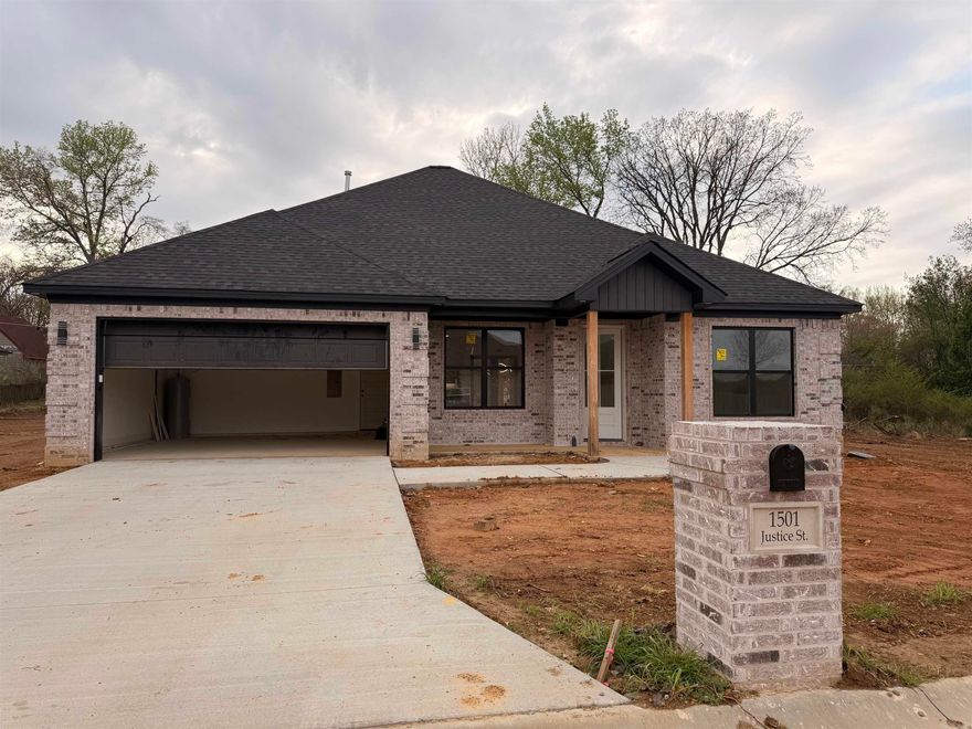 Jacksonville New Home! Enjoy this stunning new construction by Charles Anderson Homes! This residence boasts every luxury you could desire. The foyer opens up to a spacious Great Room with an inviting open floor plan and a stylish recessed electric fireplace. The kitchen and dining area showcase beautiful Quartz countertops, a range alcove with surround, and a large island that serves as additional dining space. Enjoy exquisite ceiling and cabinet fixtures throughout the home. The private Master Suite features double vanities, luxury vinyl flooring, a garden tub with upgraded tile surround, a custom tile shower, and two walk-in closets. On the opposite side, you'll find two bedrooms along with a guest bath and laundry room. Step outside to the covered porch, complete with an outdoor fireplace for cozy evenings. Plus, enjoy peace of mind with a One year Home Builder's Warranty! PROFESSIONAL PICTURES COMING, COMPLETION DATE APRIL 1, 2026