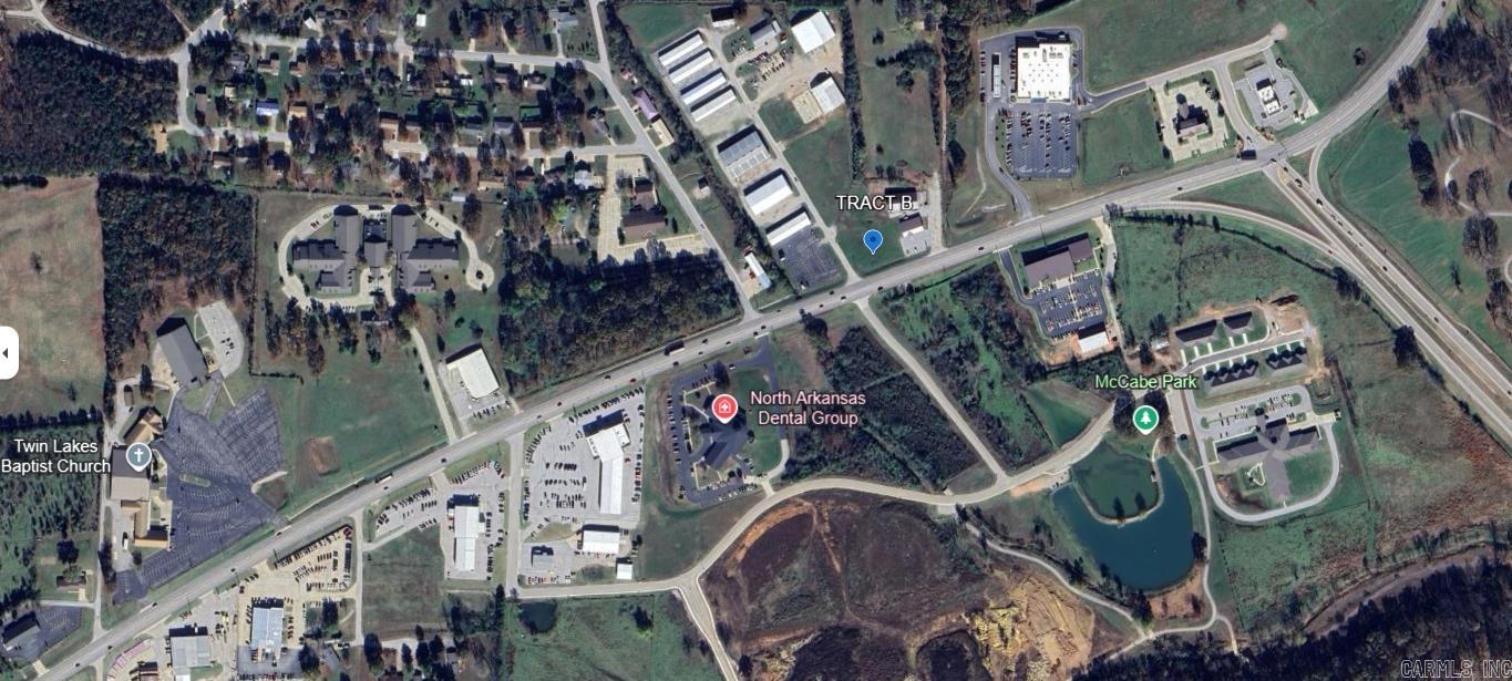 Prime commercial property with 190 feet of Highway 62 frontage, located directly across from the entrance to the new community center on the growing side of town. This cleared and flat 2 AC M/L lot offers high visibility and easy access, with daily traffic estimated at 19,000 vehicles (2018 traffic data, likely higher now). The property is already equipped with all utilities, including fiber internet, making it ideal for development. Zoned C-2, it’s perfect for a wide range of commercial uses such as a hotel, restaurant, shopping center, warehouse space, retail storefront, and more. Additionally, there is an entrance already in place off Industrial Plaza, providing convenient access to the property. This is an excellent opportunity for businesses looking to capitalize on the high traffic and growth of the area!