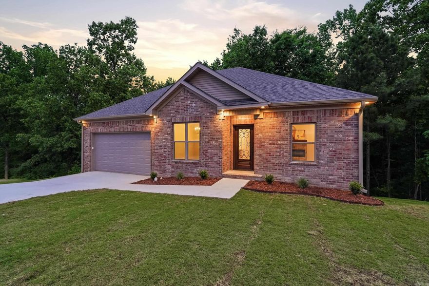 Welcome to 249 Pleasant Holly Drive - A new home with tons of upgrades tucked away in a quite cul-de-sac, in Benton SD. This beautifully built 4 bd/ 2 bath home offers a serene, park-like backyard complete with a picturesque stream. Inside, you'll find an inviting open floor plan with 9' ceilings, and designer finishes throughout. The kitchen overlooks the dining & living areas, includes a breakfast bar, pantry & custom cabinets that stretch all the way up to reach the ceiling. The primary suite is amply sized, features a large walk-in closet & a well-appointed ensuite bath with dual sinks and tile shower. Double doors lead to the huge crawl space that offers tons of storage space. Other notable features include luxury vinyl throughout (no carpet), stainless appliances, gas range, & under cabinet lighting. This home combines comfort, style, and a peaceful setting-perfect for everyday living an entertaining alike.