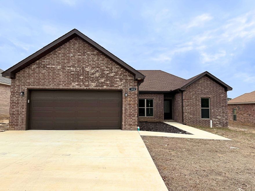 Step into elegance with this all-brick new construction home on the peaceful outskirts of Brookland, AR. This beautifully designed home features quartz countertops, a vaulted living area with a cozy fireplace, and a functional breakfast bar. Enjoy outdoor living on the covered patio, perfect for relaxing or entertaining. Conveniently located just a short drive from Brookland schools, this home combines modern features with a serene setting. Make 1810 N. Oak your new address schedule a tour today!