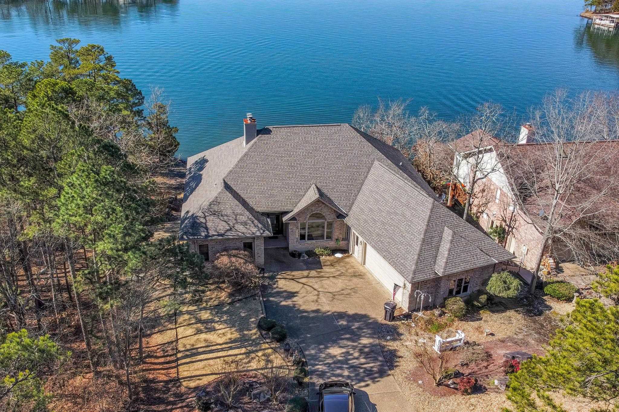 Stunning, well appointed home on sought after Lake Balboa. The views from this home are priceless. Large master bed & bathroom with door to the upstairs deck to enjoy the views. Upstairs guest suite with guest bathroom and sitting area. Downstairs offers a 5th room that could easily be used as media room or office, den area with fireplace, access to the downstairs deck, access to dog run, 2 add’l bedrooms and large bathroom. Apx.132 ft on lake, mature landscaping, and covered boat dock. SEE AGENTS REMARKS.