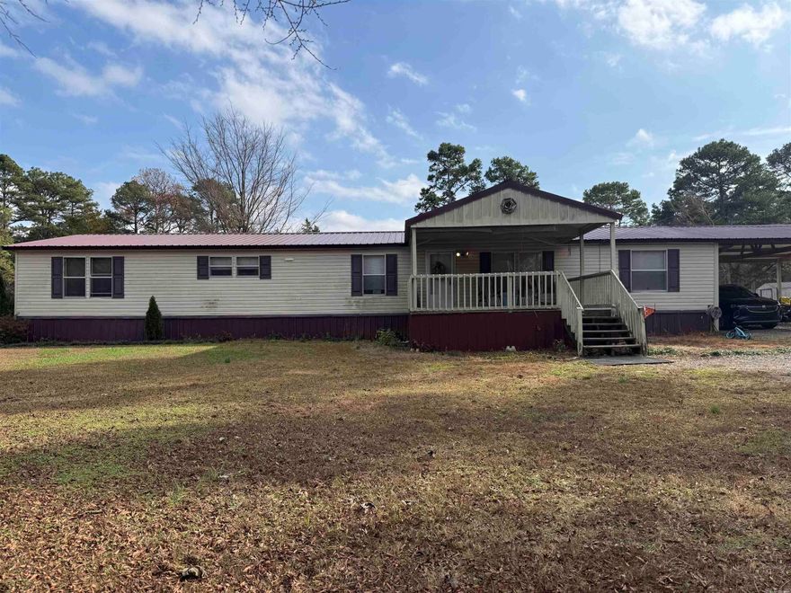 Spacious and well-maintained 4-bedroom, 2.5-bath mobile home situated on 2.71 acres, offering room to spread out while still enjoying convenient access to town. This home features two separate living rooms, perfect for entertaining, a play area, or a home office setup, along with a dedicated dining room for gatherings and family meals. All bedrooms are generously sized, providing comfort and privacy for everyone. One living area is highlighted by a cozy gas logs fireplace, adding warmth and charm to the space. The thoughtful floor plan makes everyday living easy and functional. Outside, you’ll appreciate the metal roof for durability and low maintenance, a two-car carport for covered parking, and multiple fenced areas ideal for pets, gardening, or creating separate outdoor spaces. Enjoy peaceful country living with the convenience of nearby Bald Knob or Batesville, making this property an excellent opportunity for those seeking space, comfort, and accessibility. Call to schedule a showing.