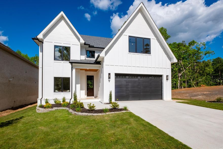 Stunning New Construction Home with Wooded Views & Modern Luxury! Welcome to this exceptional new construction home where luxury meets comfort in a serene, wooded setting. Step inside to discover an open-concept kitchen, living, and dining area that seamlessly flows together. The gourmet kitchen is a showstopper, featuring high end appliances, custom cabinetry, and a huge walk-in pantry with built-in cabinetry for all your storage needs. Large windows line the back of the home, offering breathtaking views of the lush, wooded landscape. The main-level primary suite is a private retreat, complete with a spa-like ensuite bath and large walk-in closet. An additional guest suite on the main floor provides the perfect space for visitors or multi-generational living. Upstairs, you will find a spacious bonus room perfect for a media room, playroom, or home office along with a private suite and two additional bedrooms with a shared bath. Outdoor living is elevated with a large patio deck overlooking the thick wooded backdrop, creating a peaceful, private oasis for entertaining or relaxing year-round. Schedule a showing today!