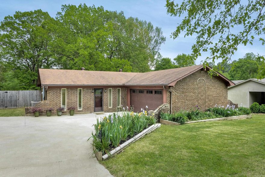 One level home with enclosed porch and small basement area situated  on 1.46 acres with the most incredible barn wired for 220!! This is the most beautiful spot and perfect for a garden!  Three bedrooms and two bathrooms plus an office or formal area. The kitchen opens to a wonderful living area looking out to the spacious backyard.  Wildlife, mature trees and gorgeous views of nature await !  Come see!