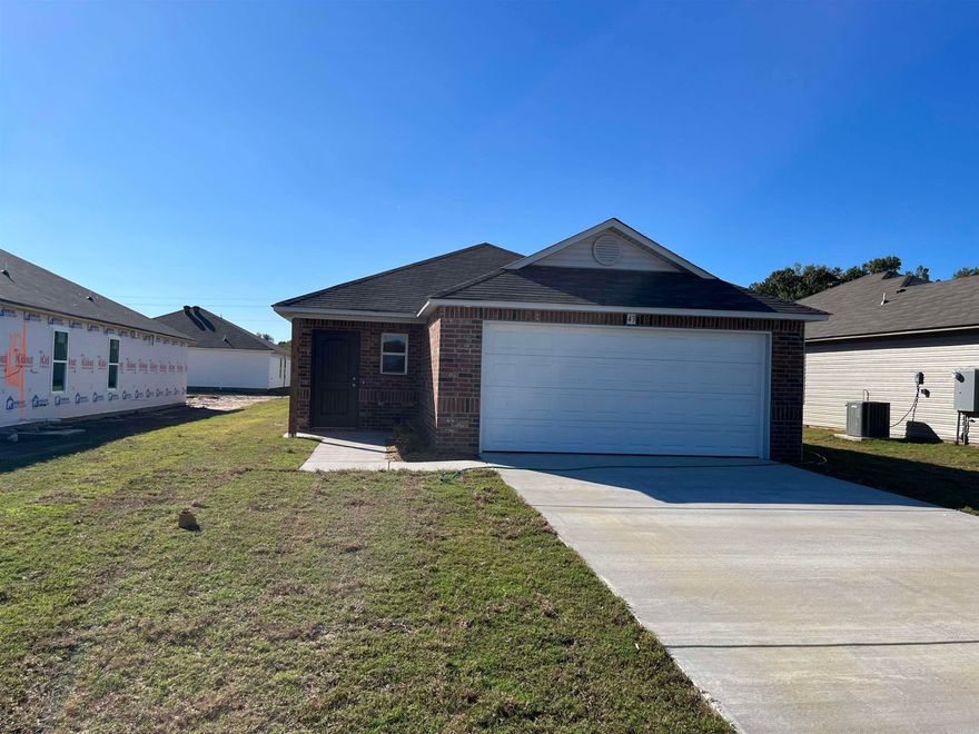 The convenient Mitchell plan! This home has a welcoming entry that opens into a Living Room with plenty of natural light. The eat-in kitchen has a convenient layout and has a back door that opens to a covered back porch. The Master Bedroom boasts a generous closet that is separate from the Master Bathroom.  Upgrades included in this home: 3050 Low E window in Master Bedroom, plumbing faucet upgrade 2, crown on Kitchen cabinets, 16" laminate bar top in Kitchen, Luxury Vinyl Plank flooring in wet areas and Living Room and adjacent hallways, raised ceilings in Living Areas per municipal requirements, Cheyenne style interior doors, baseboards level 2, attic stairs, LED disk lights in Kitchen, full sod, microwave hood in Kitchen, smooth top range.   THIS HOME IS COMPLETE.