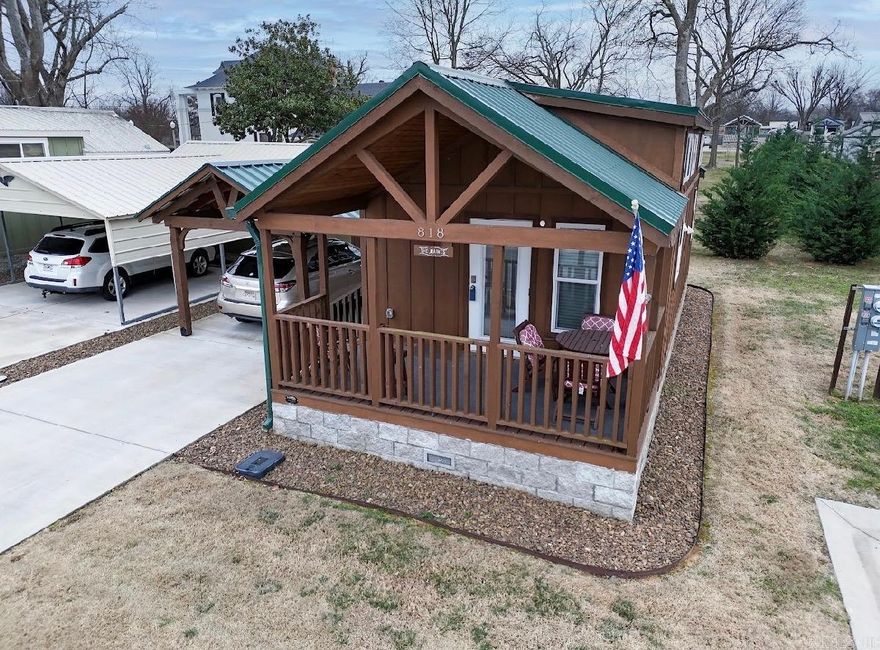 Energy-efficient Platinum Cottage built in 2022 offering smart, low-maintenance living in the heart of Rogers. This single-level, all-electric 1-bedroom, 1-bath home features 510 sq ft of well-designed space with a versatile loft ideal for extra sleeping space, office, or storage. Enjoy the expanded front porch and a thoughtfully designed interior with LVP flooring, taller ceilings, ceiling fans, window blinds, double-insulated walls, and two energy-efficient mini-split systems. The functional kitchen includes upgraded appliances, and all appliances convey, including washer, dryer, and refrigerator.  Exterior highlights include a durable metal roof, double concrete driveway, high-quality custom wood carport, and a detached insulated shed for added storage. Low utility costs and minimal upkeep add to the appeal. Ideally located just minutes from Downtown Rogers and approximately 10 minutes from the Walmart Home Office, with convenient access to shopping, dining, parks, schools, the Greenway Trail, hospital, and fire station.  Must be owner-occupied; rentals not permitted.