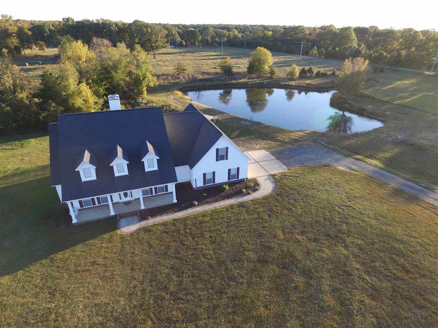 A place for family living and fun in the country! 4BR/2.5BA on 6+ac w pond, barn, 50x30 shop w elec, fenced 4 horses, storm shelt, & screen porch on exterior.  Int has 2 dining areas, open plan, kitchen has SS appliances w solid surface counters, dbl convection oven, hardwood floors, bonus room, two HVAC units. Mast bath has very unique tub & separate tile shower.  Lots of storage.  Must see to appreciate all this house has inside and out.