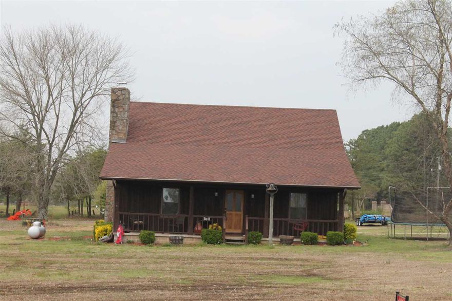 Beautiful cedar home on 5 acres.  Woodburning fireplace.  Country feel with convenient access to Hwy 64B.    Property includes barn and in-ground pool.  Easy commute to Conway, Jacksonville, LRAFB.