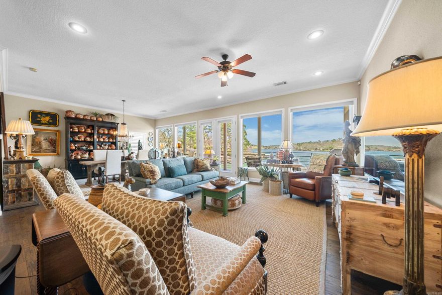 Luxurious Waterfront Living and Investment Opportunity. Presenting an exquisite three-level modern waterfront townhouse boasting 4,050 square feet of sophisticated living in the esteemed Hamilton Peak community. This exclusive enclave comprises only 4 townhomes,ensuring unparalleled privacy and stunning panoramic views of Lake Hamilton. What makes this property truly exceptional is the HomeOwners Association (HOA) allowance for short-term rentals, making it a savvy investment choice for Airbnb. Top-Level Luxury ascending the stairs,you'll find a versatile bonus room leading to three bedrooms, two baths, and a convenient laundry room. The grand primary suite positioned lakeside, featuring vaulted ceilings and expansive glass walls that offer an uninterrupted connection to the serene lake. Step onto the screened balcony to immerse yourself in the breathtaking views. The luxurious primary bath has a double sink vanity, a spacious walk-in shower, and an indulgent soaking tub. Main Level Elegance. The main level seamlessly merges an open concept floor plan, encompassing the kitchen, family room, and dining area. Every seat offers panoramic lake views. Only $219 per sq ft. Great price!!