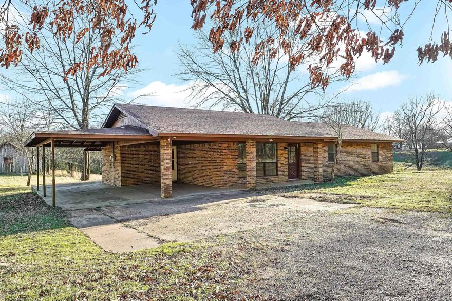 Recently updated and move in ready.  Check out this 3 bedroom 2 bath home, with 1582 sqft of heated and cooled living space.  A large covered back porch with , outdoor storage building/Barn and a storm shelter all sitting on 1.75 acres mol. New architectural shingled roof in July 2024