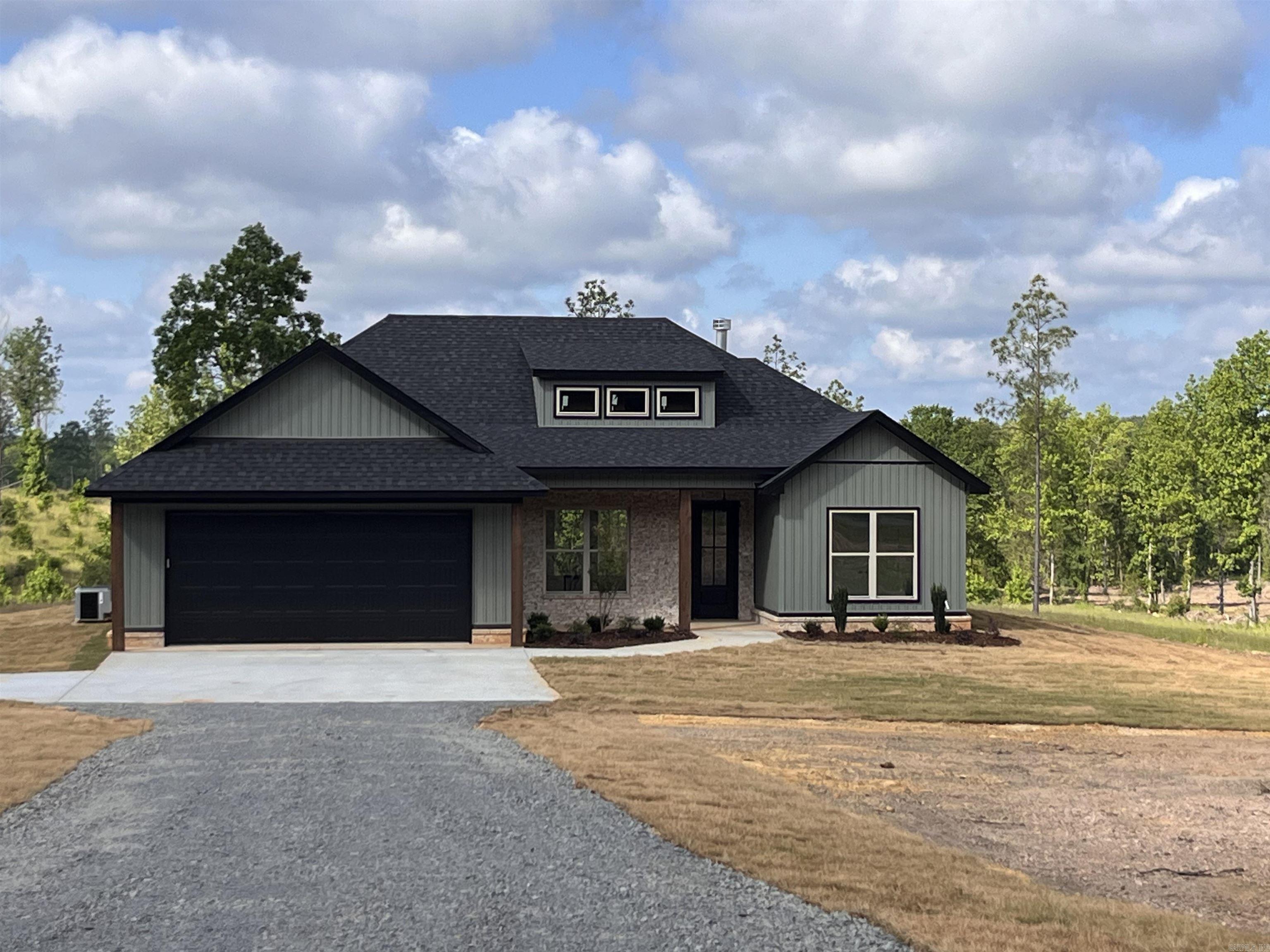 Beautiful New Construction home in the country yet close to town! Lots of space and plenty of room. This home is a must see! Open kitchen with large island, custom cabinets with open shelves, large window over sink overlooking beautiful back yard, brick fireplace, wood beams, large walk in pantry, laundry room connects to the master closet, large primary suite with wood beams, large primary walk in closet & bath. This home has so many custom features! The backyard is beautiful and has lots of space!