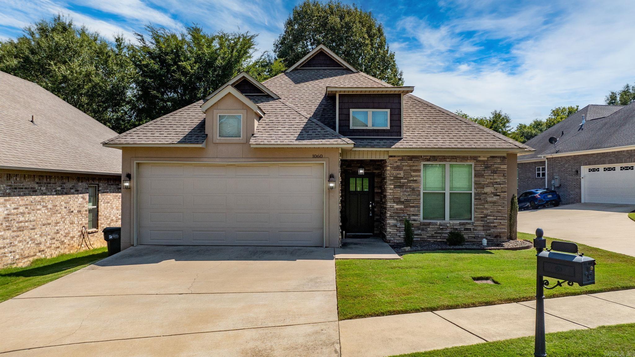 Freshly painted and move in ready, this beautifully updated 4 bedroom 2 bathroom home offers a low maintenance lifestyle with a zero lot line design and easy care flooring throughout. Enjoy a spacious open concept layout featuring a large dining area joining the kitchen and living room perfect for entertaining. The kitchen boasts granite countertops and modern finishes while the cozy living room provides a welcoming space for relaxing or hosting guests. Retreat to the oversized master bedroom complete with a private water closet, separate shower and tub and a generous walk in closet. Step outside to a large deck overlooking a quiet, peaceful field ideal for morning coffee or evening gatherings. This home combines comfort, convenience, and style and one perfect package