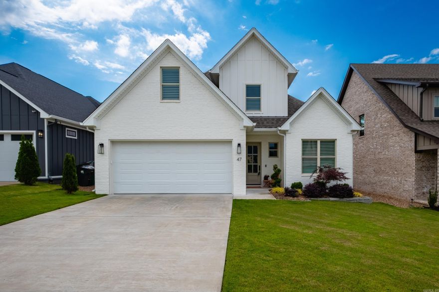 Built in 2023 and designed with a functional, easy flow, this like new home offers stylish finishes and comfortable living throughout. Gorgeous flooring, plantation shutters, and abundant natural light create a warm and inviting feel. The main level features a spacious primary suite with a spa inspired bath including a soaking tub, plus a separate guest bedroom and full bath ideal for visitors or office space. The living area centers around a gas log fireplace and floor to ceiling windows that bring in wonderful natural light and views of the beautifully landscaped backyard. Open to the dining area, the kitchen is fantastic with a 5 burner gas cooktop, wall oven, breakfast bar, granite countertops, and an abundance of cabinetry and storage. The laundry room also includes additional storage space. Upstairs offers a vaulted bonus room, two guest bedrooms, and a hall bath, providing flexible living options. Enjoy the covered back patio complete with Insoroll remote patio shades, extensive landscaping, and a fully fenced backyard. Beautifully maintained and move in ready with a great layout for everyday living. Neighborhood pool park currently being built.  Come see!