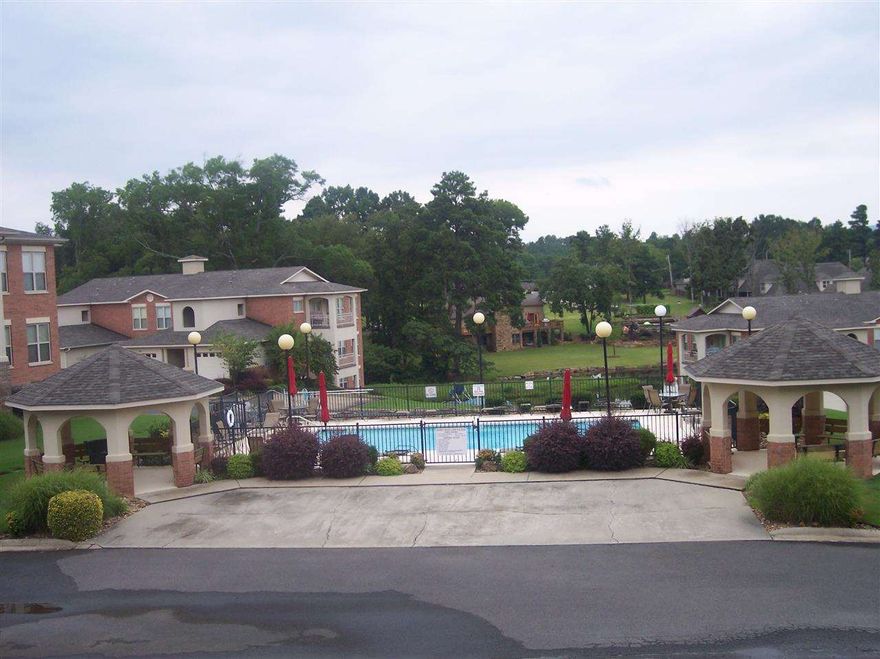 2 BR, 2 Bath like new condo with beautiful lake views in a gated community. Open floor plan with two fireplaces and lots of storage with built ins. Beautiful grounds with swimming pool, picnic area and private driveway and parking with unlimited car parking. Access to Lake Hamilton with tie up boat slip. Access to covered and enclosed garage.