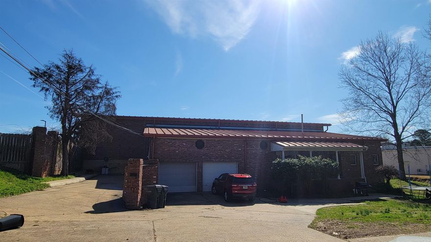 Centrally located in Jonesboro in a high visibility area. Warehouse space and two income producing apartments attached. Additional area for parking or an additional building.
