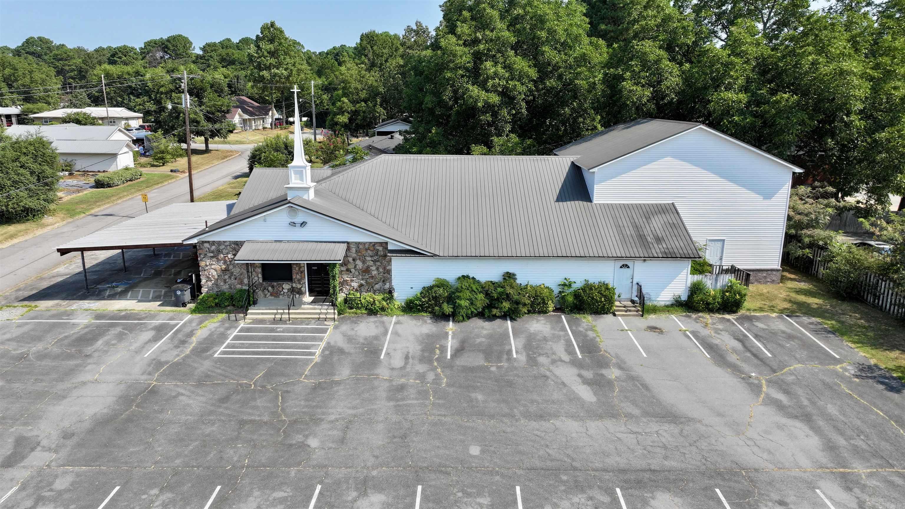 This unique property offers endless potential in a high-visibility location. Currently operating as a church, the building features spacious open areas, multiple offices/classrooms, restrooms, and ample parking. Its adaptable layout makes it ideal for continuing as a place of worship or transforming into a new development such as office space, community facility, or specialty retail. With excellent street frontage and convenient access, the property sits in a growing area that supports both community-based and commercial uses. Whether youāre looking to preserve its current purpose or unlock its redevelopment possibilities, this property delivers flexibility, visibility, and opportunity all in one.