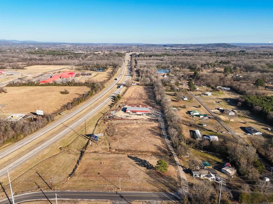 Unmatched interstate visibility with this 12.5± acre industrial-zoned property offering a 7,686 sq ft metal commercial building already in place. Outstanding exposure, easy access, and room to expand make this an excellent opportunity for businesses or investors.