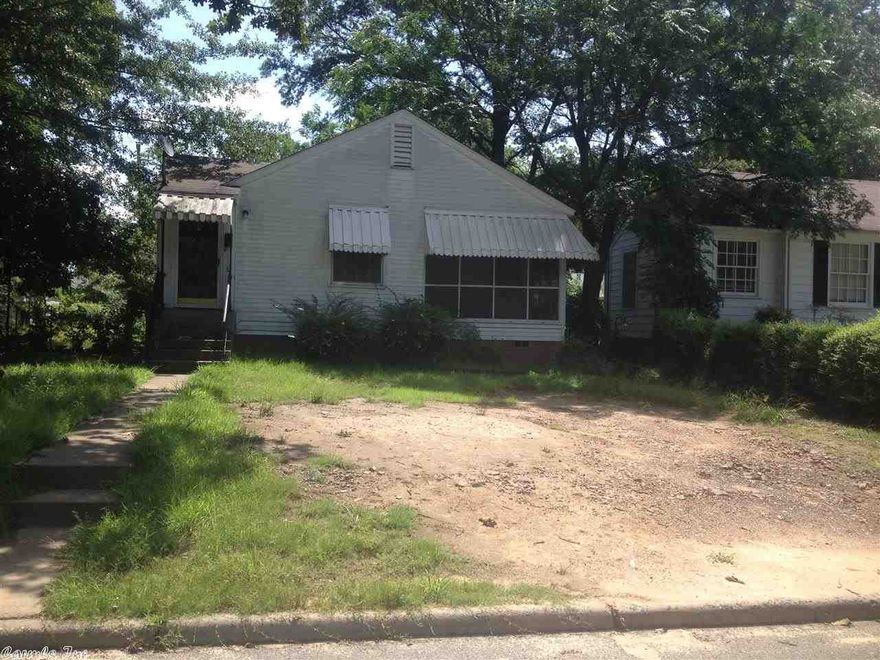 Great investment home with nice wood floors.  Needs some fix up but good bones.  Two bedrooms, living room, dining room and sun porch.  Nice deck, large yard, storage building. Near UALR, shopping and eateries.