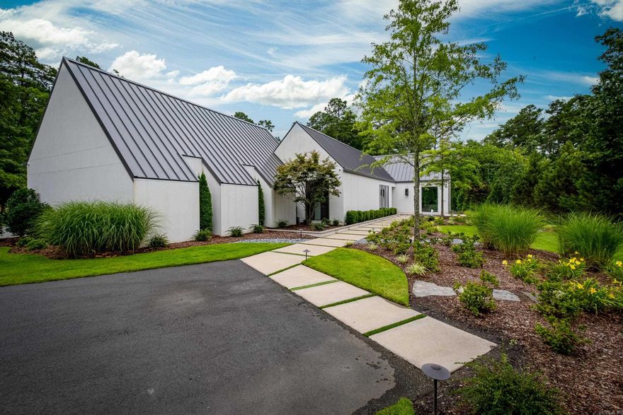 Welcome to this stunning contemporary one-level home located on the prestigious Chenal Country Club Golf Course. With its breathtaking views overlooking the picturesque 17th hole, this property offers the epitome of luxury living. The outdoor oasis features a saltwater pool, perfect for a refreshing swim, & a relaxing hot tub. As you step inside, you'll be greeted by a beautifully designed courtyard creating a serene space for outdoor entertaining. The interior boasts 10-foot glass windows throughout, allowing for an abundance of natural light and showcasing the magnificent views of the golf course. This is a true smart home w a Control 4 automation system, offering seamless control over lighting, temperature, and entertainment. The spacious floor plan encompasses four bedrooms and four & a half bathrooms, providing ample space for family and guests. The meticulously appointed kitchen features top-of-the-line appliances, making it a dream for any chef or culinary enthusiast. This gated neighborhood offers privacy & exclusivity. Immerse yourself in luxury & experience the epitome of contemporary living in this remarkable home that seamlessly blends style, elegance, & coolness!!