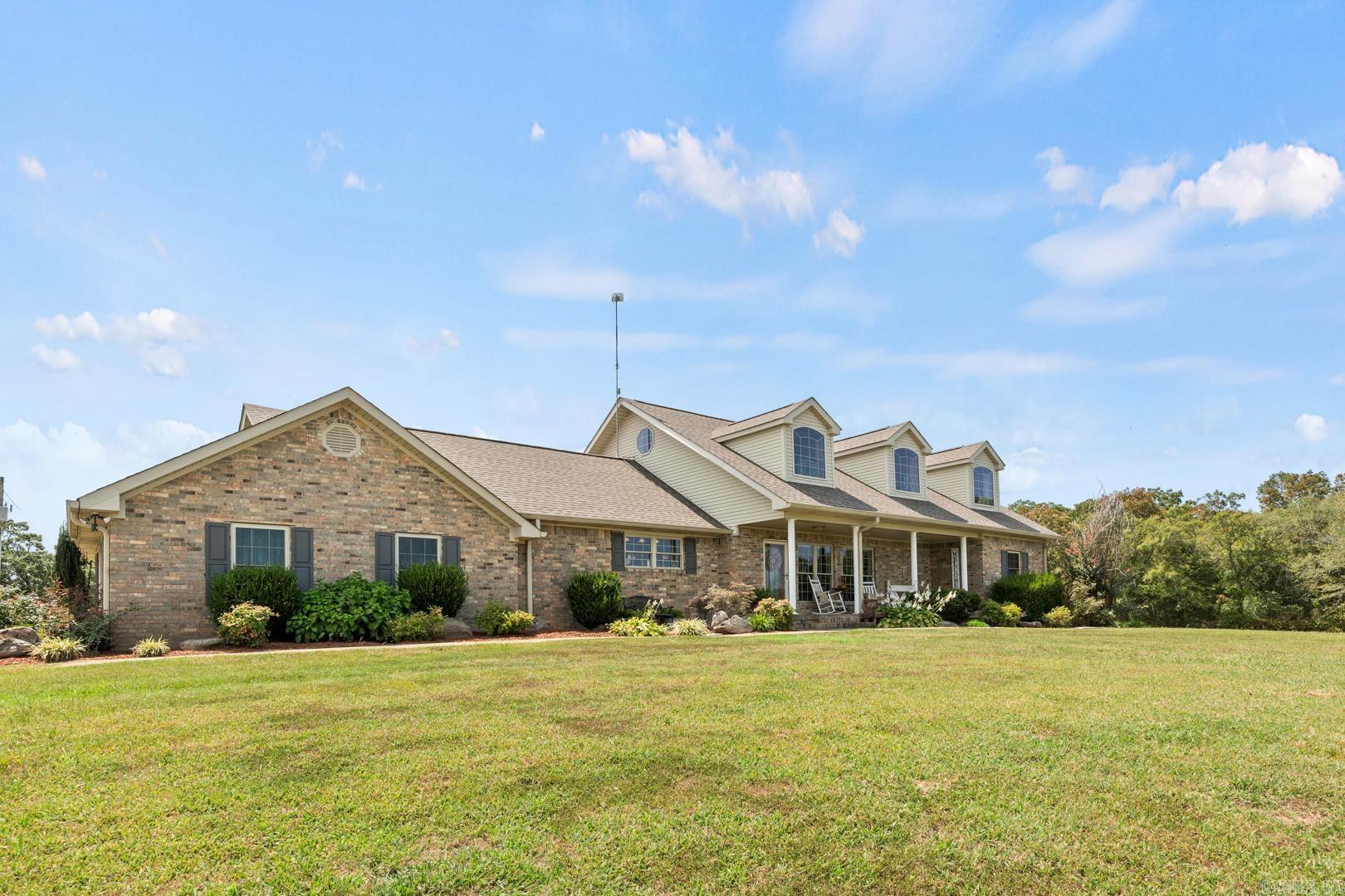 Custom Home with 80 acres for sale in Arkansas This gorgeous home sits on a hilltop overlooking the 80 acres of pastureland below and has all anyone could ask for in a property. Set up for horses (could be set up for cows easily too!) this property has four ponds, is fence and cross fenced And has multiple building sites. The home is a two story five bedroom three and a half bath with swimming pool, veranda, porches, patios with outdoor kitchen space, smoker and more. Automatic stand by whole house generator, two car attached garage and many extras. The home has custom built black walnut cabinetry, black walnut hardwood floors, and staircase. There are three fireplaces. The kitchen is well appointed, has a pantry, dining room and breakfast area. There is nothing left to do with this property, and It’s ready for you to move in.