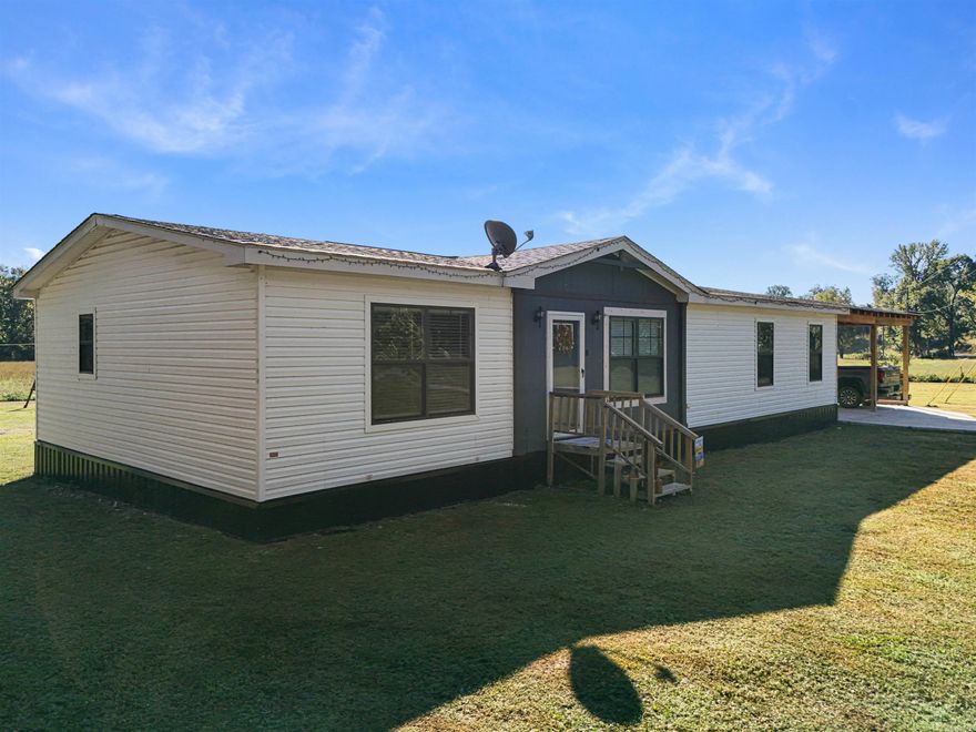 BEAUTIFUL YEAR-ROUND CREEK LIVING!! This 2022 model 3bed 2 bath manufactured home on a permanent foundation on 5 acres is 1/8 of a mile outside the Cortez Gate of Hot Springs Village in Jessieville School District  Boat? RV? ATV? Dogs? Chickens? Bring them all!! Enjoy convenient and peaceful country living with a room to store all your toys! If you are a Village property owner, use the convenient access of Cortez Gate to take in a round of golf, tennis, or pickleball, or go fishing! It’s the best of both worlds! This beautiful home offers roomy indoor and outdoor living with wide open spaces. The roomy living-room is the perfect place for family-time! The kitchen with a huge walk-in pantry has room to store all your cooking gadgets! A spacious primary suite is inviting with a double vanity and a large tub for soaking. The combination laundry-mudroom is the perfect organized catch-all for storing the necessities. Outside, breathe in some fresh air and the pleasant smells of God’s creation under your covered patio, or cool off with a dip in the clear creek water! Don't Miss Out! Schedule your showing today!