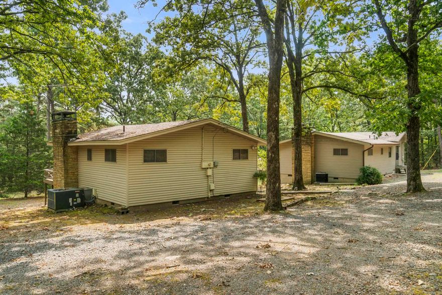 Secluded Lakefront Retreat – 2.36 Acres on Beautiful Greers Ferry Lake Two charming cabins nestled on 2.36 private acres, just minutes from Heber Springs Marina. Perfect as vacation rentals or your own private getaway. One cottage offers 2 bedrooms and 2 baths, while the other features 2 bedrooms and 1 bath. Both have cozy wood-burning fireplaces for your enjoyment. Relax on the property and take in one of the best views of the 4th of July fireworks over the lake!