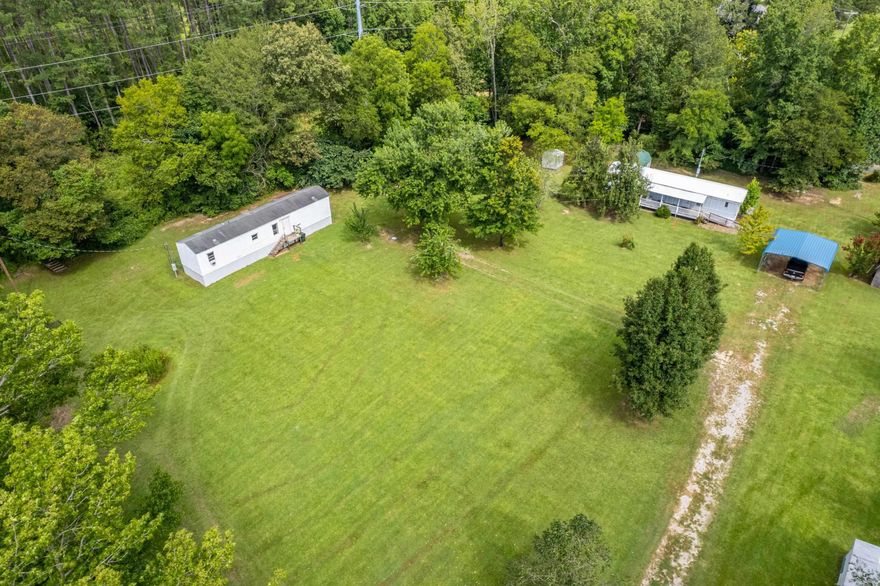Rare Find in Garland County! This stunning 4.26-acre property is a true gem, featuring Clear Creek running year-round right through the heart of the land. The property is level, cleared, and ready for your vision—whether you're seeking peaceful country living, a homestead, or investment opportunity. Two mobile homes (not on permanent foundations) are included, offering flexible use as rentals, guest homes, or temporary living while you build. 296 is a 3br/2ba, 298 is a 2br/2ba.  Also included is a she-shed with electric and plumbing.   Breathtaking natural beauty, abundant space, and unlimited potential—this is a must-see property you won’t want to miss!  Back on market at no fault of sellers/property.  If financing be prepared to pay for flood insurance on both homes.  In-house financing or cash only, due to not on permanent foundation.