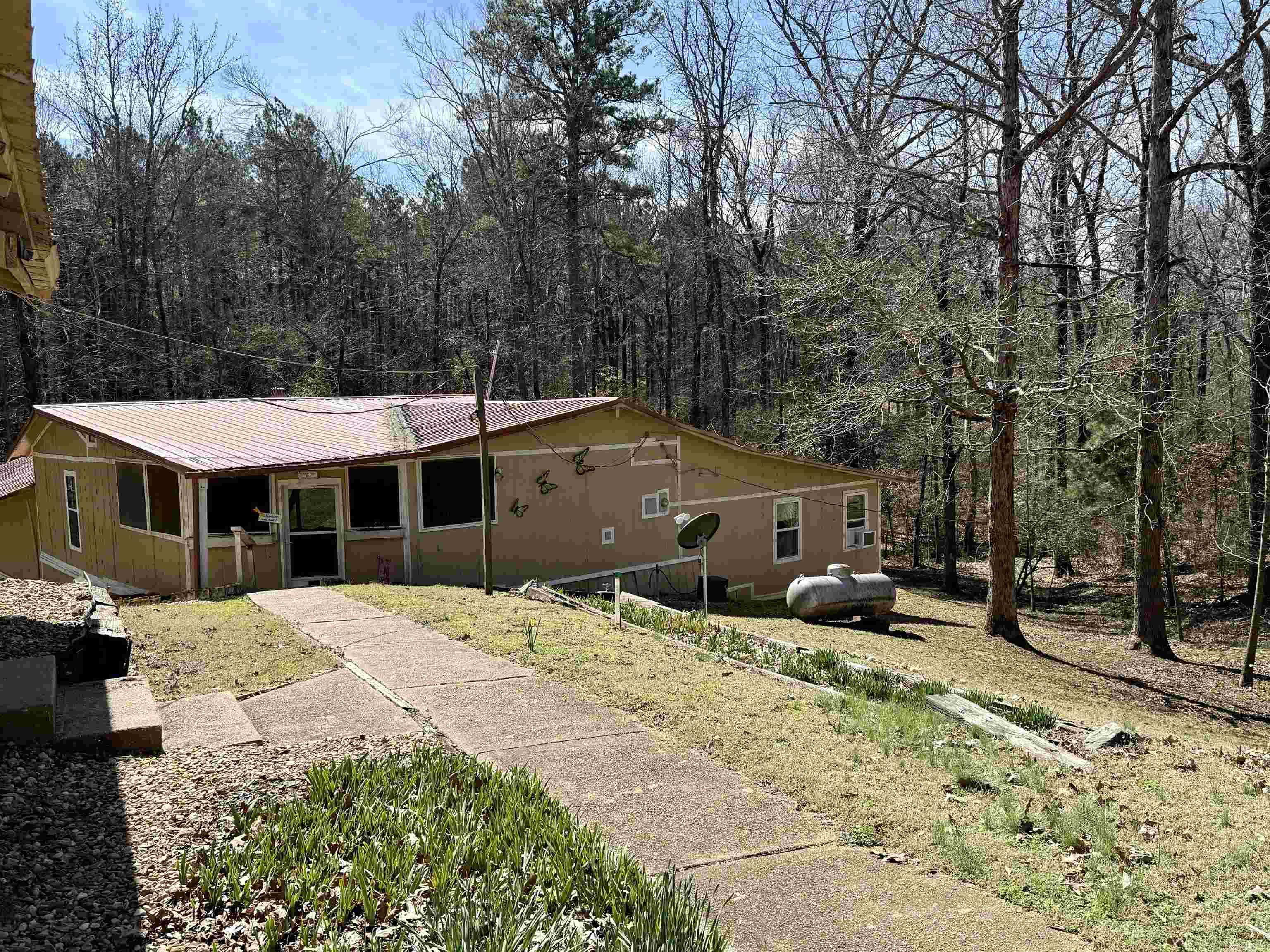 Welcome to 1010 Gum Springs Rd, a charming single-family home nestled in the serene town of Rison, Arkansas. This home has not 1 but 2 master suites with full bathrooms and a guest bedroom and guest bath. The living room and den provide a great space for entertaining. Enjoy a large screened in porch on those hot summer days and a covered grill deck for outdoor cooking. This home is perfect for living the quiet serene lifestyle. Here you are within walking distance to the Saline River for fishing and wildlife is abundant all around you. For your opportunity to see this charming home and beautiful property call today!