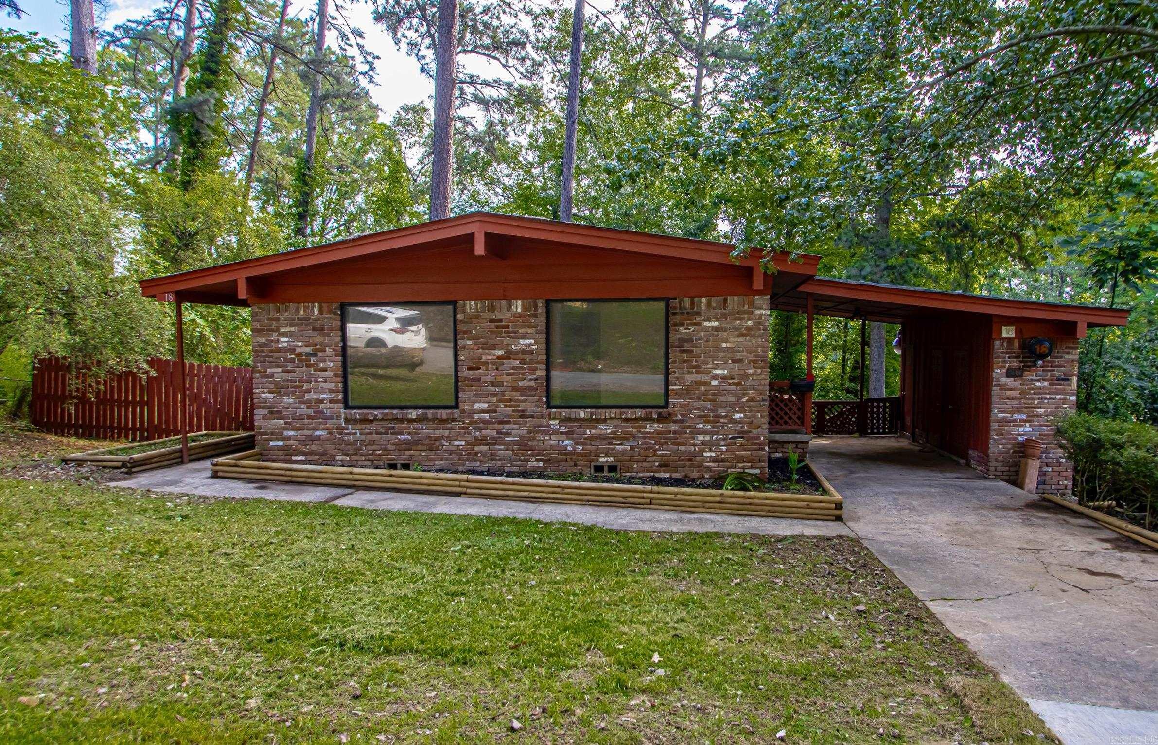 Remodeled, Move-In Ready contemporary home located near the University of Arkansas at Little Rock (UALR). ** Quiet subdivision conveniently located near shopping, dining and entertainment. ** Large Picture Windows allow for maximum natural light to the main living area ** Original hardwood floors throughout the house have been refinished. ** Granite countertops in the kitchen. New appliances, including gas range for the chef in the family. ** Remodeled bathroom with all the modern conveniences ** New fixtures throughout the house. ** Basement with outside entrance offers plenty of extra storage. Roof is 10 years old.
