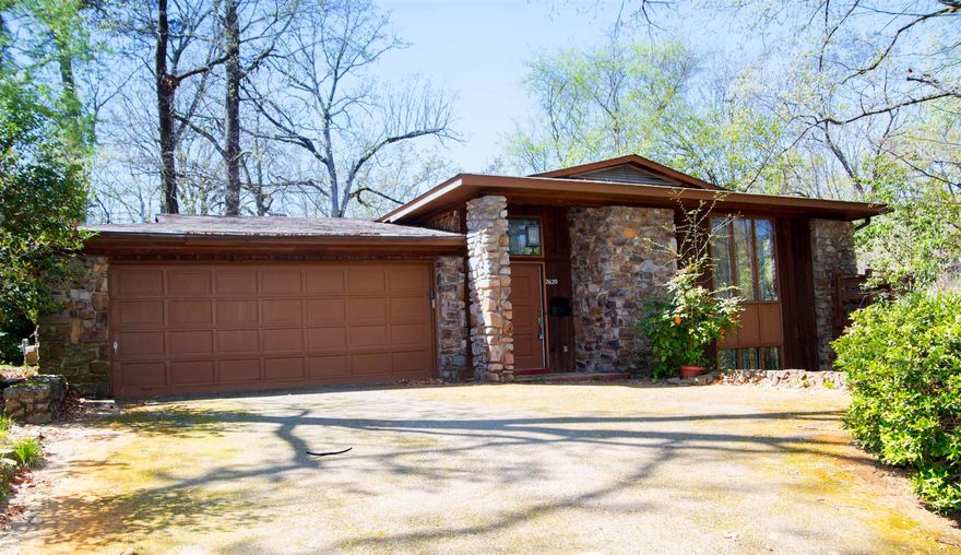 Beautiful mid-century style home located in the Heights. 3-bedroom, 3-bathroom home is situated on a quiet, private lot with a serene, wooded setting that feels incredibly cozy. It features a spacious living room with large windows, a two-car garage, and a large deck perfect for family gatherings.  Offering close proximity to great schools, hospitals, shopping, and fine dining.