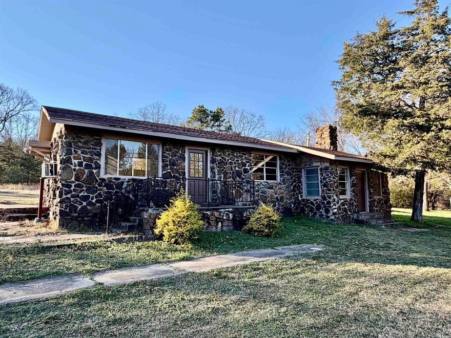 Affordable country living just off Woodland Rd. Situated on a full acre with large shade trees, a spacious flat lawn, a storage building, and room for a garden. This all-electric home features a newer architectural roof, and the owner will install a new HVAC system with an acceptable offer. The eat-in kitchen includes an electric range and refrigerator. Updated bathroom. Three bedrooms, one of which currently includes washer/dryer hookups. The lower-level bedroom offers a cozy wood-burning fireplace and a bonus area perfect for a plant room, home office, or flex space.