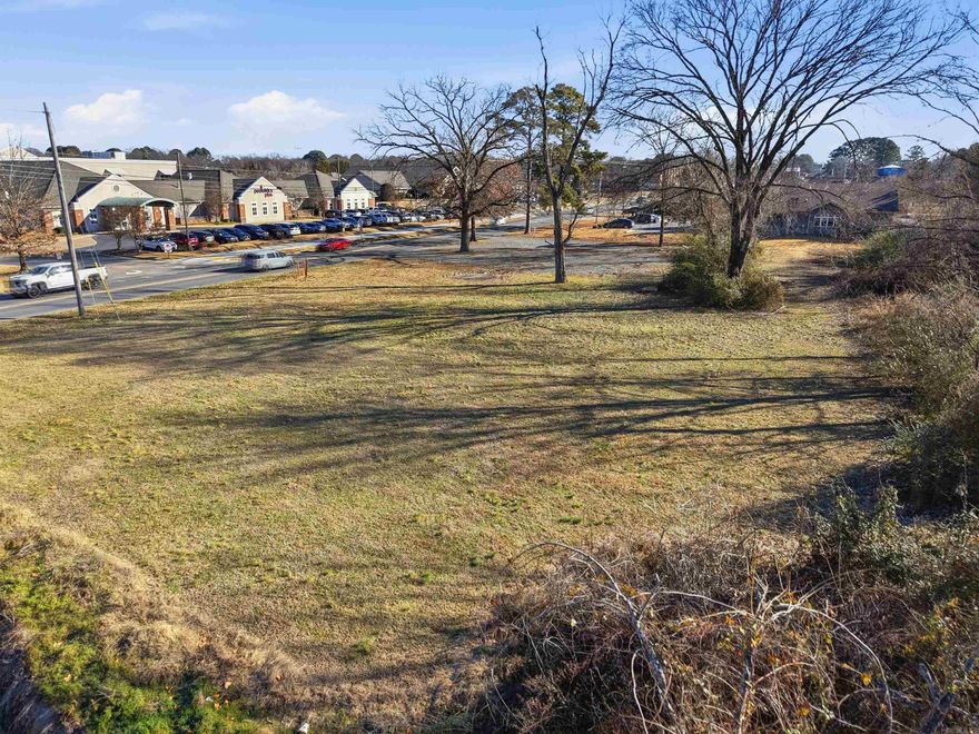 Endless possibilities await at this prime College Avenue location! Situated next to the Tucker Creek Walking Trail and surrounded by established medical offices, retail, banking, restaurants, and multi-family developments, this 1.29-acre parcel offers exceptional potential. Zoned RU-1 with a previously approved conditional use permit for a coffee shop, the property sits in the heart of Conway’s daily commuter corridor. With ARDOT traffic counts averaging 12,000–15,000 vehicles per day, this high-visibility site is ideal for positioning your business for long-term success. If you can envision it, this location can bring it to life.