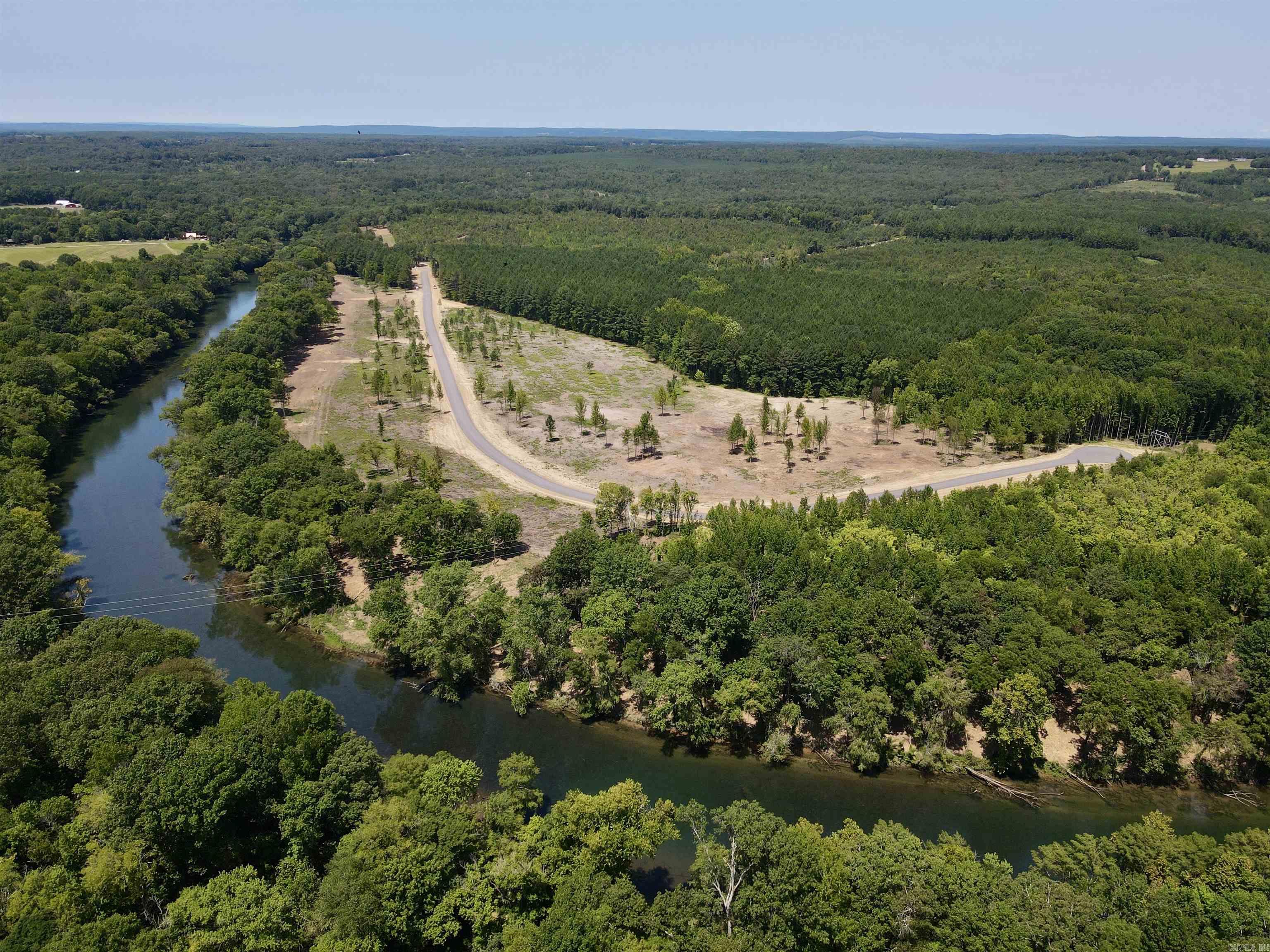 5.13 acres m/l of trout fishing on your riverfront property on the Little Red River just 3 miles from Pangburn. (Lot #23. See map.) World class trout fishing right outside your back door! This stretch of the Little Red River is known for both quality and quantity of trout. There are numerous rainbow trout and brown trout that call this stretch of the river home. You even have access to your own private boat launch! This property boasts access to your own private, gated boat launch. Located 3.2 miles upstream from the Ramsey's Access, and 2.6 miles downstream from the Dripping Springs Access. If you know, the Little Red River is home for many aquatic species, and also many other species unique to a tailwater ecosystem. It's not uncommon to see bald eagles, river otters, whitetail deer, turkey, and a multitude of migrating waterfowl. There are many resident Canada geese and wood ducks! It's truly a sportsman's paradise. This riverfront property is tucked away and protected by large, mature pine trees on the north side, and the Little Red River on the south side. For you lake lovers, you're 15 miles from the Dam Site boat launch on Greers Ferry Lake!