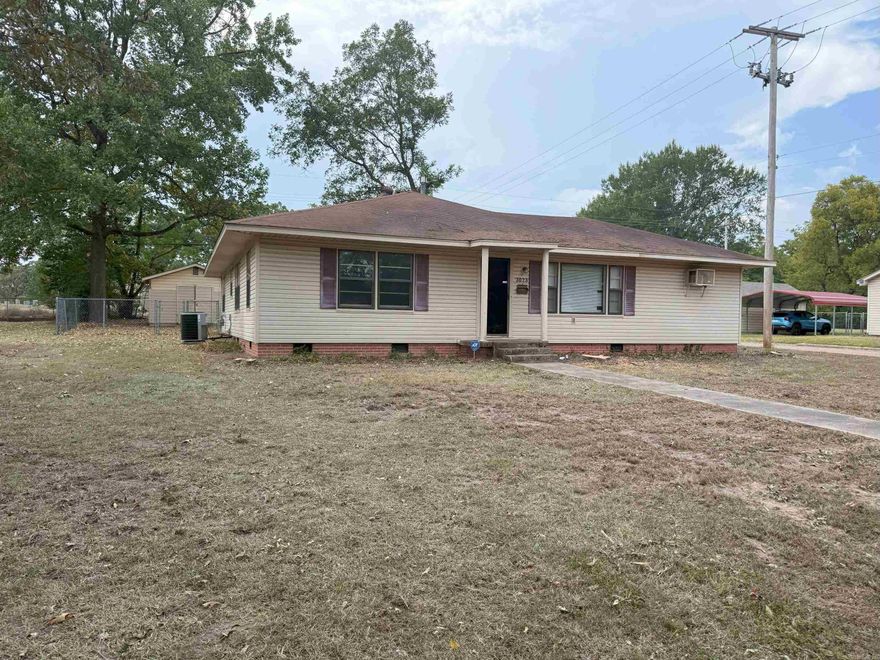 Three bedroom spacious home on a corner lot. Fenced back yard with storage building. Formal dining/den combination with gas log fireplace. New vinyl planking. HVAC replaced approximately 2022. Office with separate entrance. Large storage room off the carport.