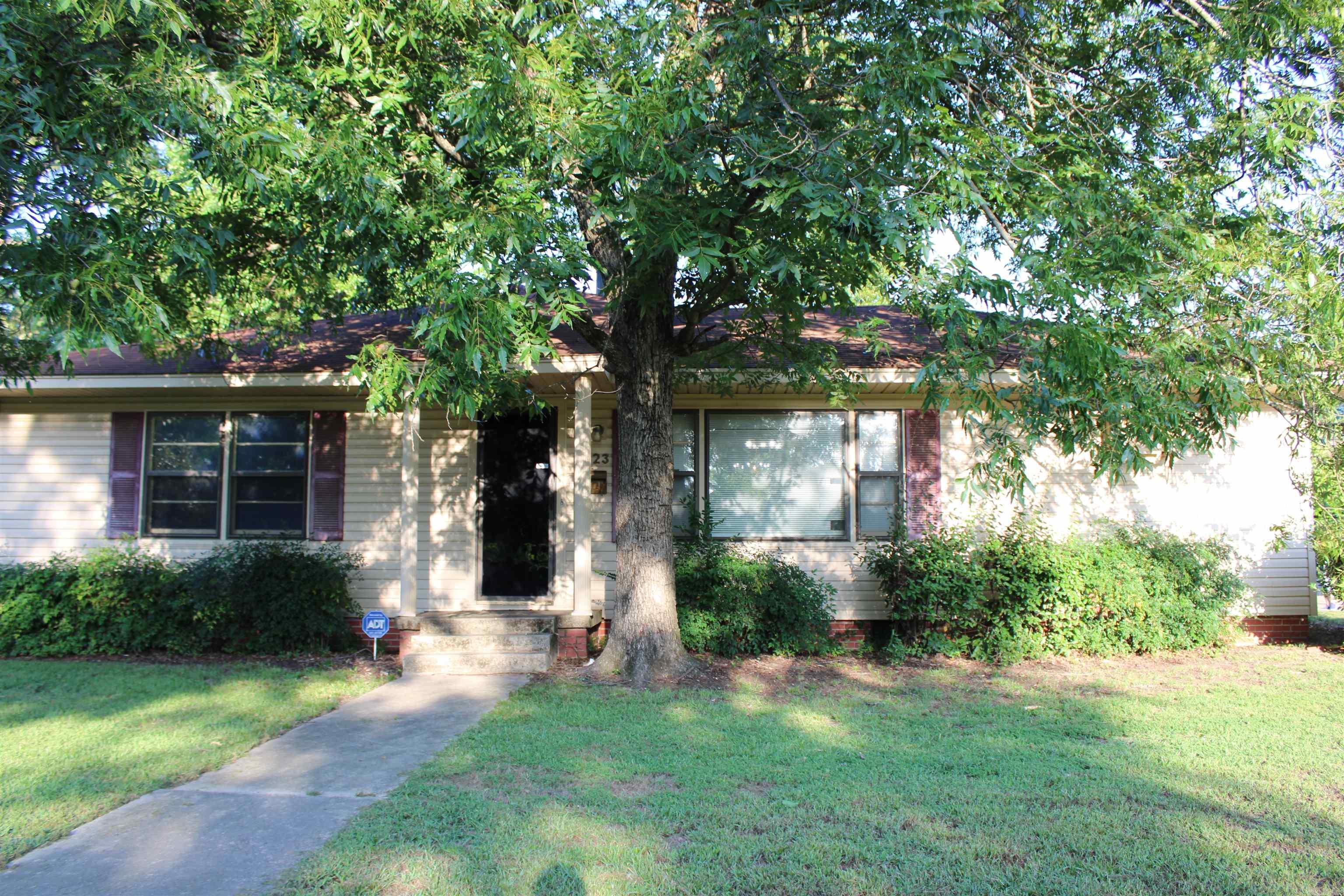 Three bedroom spacious home on a corner lot. Fenced back yard with storage building. Formal dining/den combination with gas log fireplace. New vinyl planking. HVAC replaced approximately 2022. Office with separate entrance. Large storage room off the carport.