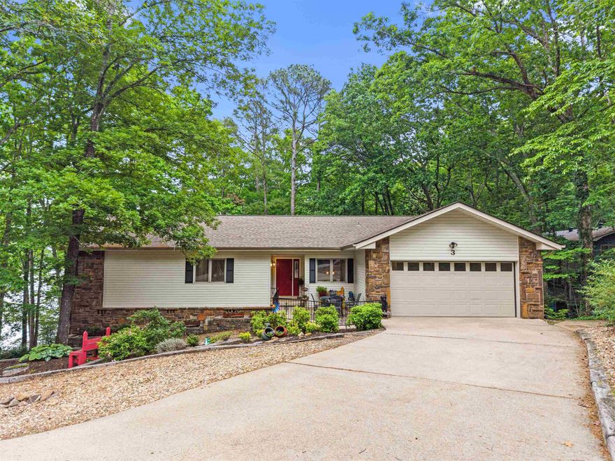 Nicely remodeled home with lake view and common area access to Lake DeSoto! Launch your kayaks right from the shore! Wood burning fireplace in the huge great room with slider to entertainment size rear deck with view! Quality luxury vinyl plank flooring on both levels! Primary bedroom also has access to the deck, a dual vanity, shower and walk-in closet! The Arkansas room offers yet a 3rd access to the deck and a wall of windows overlooking trees and Lake DeSoto! The basement features a fully remodeled full bath, the 3rd bedroom, and a slider to the rear patio! Workshop on side of home is large enough for a workbench and additional storage. Large Laundry room and 1/2 bath! ONE YEAR OLD IMPACTED RESISTANT ROOF! Walk to the nearby Waypoint Marina or continue on a several mile long walking trail! The 26,000 gated acres of Hot Springs Village boasts 11 lakes & 9 golf courses, fitness center, tennis, pickleball, 2 pools, 20+ miles of walking trails, mini golf, bocce ball, and much more! DON'T MISS THE VIRTUAL TOUR!