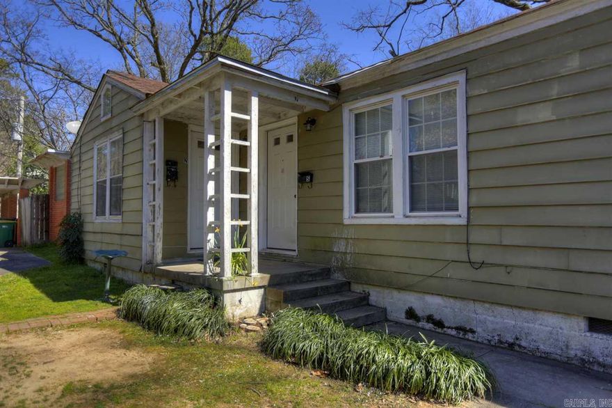 Cute spacious 2bed 1bath unit in a Duplex features hardwood floors through out with large private yard, one car covered carport. This adorable unit comes complete with a washer/dryer, refrigerator, and microwave. The island you see in the kitchen also stays. Updated bathroom and fresh coat of paint. New owners- Yard is amazing. Call Jim for personal tour today at Call Jim @ 501-765-0250