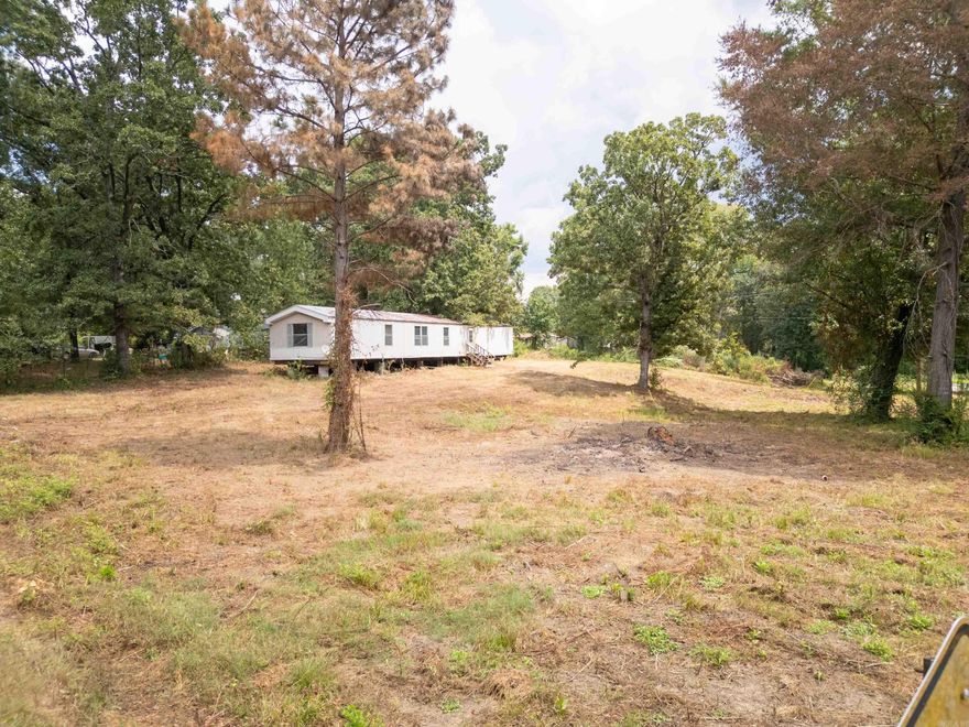 This .5 acre unrestricted and cleared lot across the street from Harris Brake has utilities on the property. There is a mobile home on the property but it needs work and is missing all electrical, plumbing and HVAC systems. Mobile home has been given no value. Property is as-is.