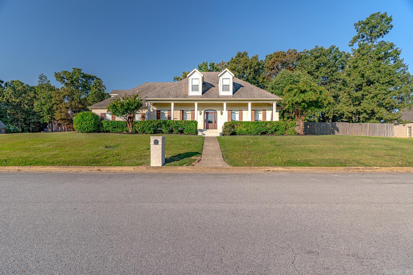 Welcome to the market 4405 Wood Crest Drive in Lake Crest Estates, within the sought-after Valley View School District. This 4-bedroom, 3.5-bath home offers over 3,800 sq. ft. of refined living with classic brick colonial style. The main-level primary suite features a sitting area, spa-like bath with whirlpool tub, private potty room, walk-in shower, and oversized closets. The heart of the home has been updated with fresh paint and includes an eat in breakfast bar. The open floor plan flows seamlessly into spacious living areas, including a formal dining room, great room, office, game room, and bonus room. This corner lot provides privacy and an outstanding view of the lake from the front porch. Outdoors, enjoy a private retreat with an inground pool, patio, and screened porch with fireplace for those chilly nights. A two-car garage, golf cart garage, and extra parking pad add convenience. Listed at $549,900, this move-in ready home combines elegance, comfort, and location—making it a rare find in Jonesboro. Call today to schedule your tour!