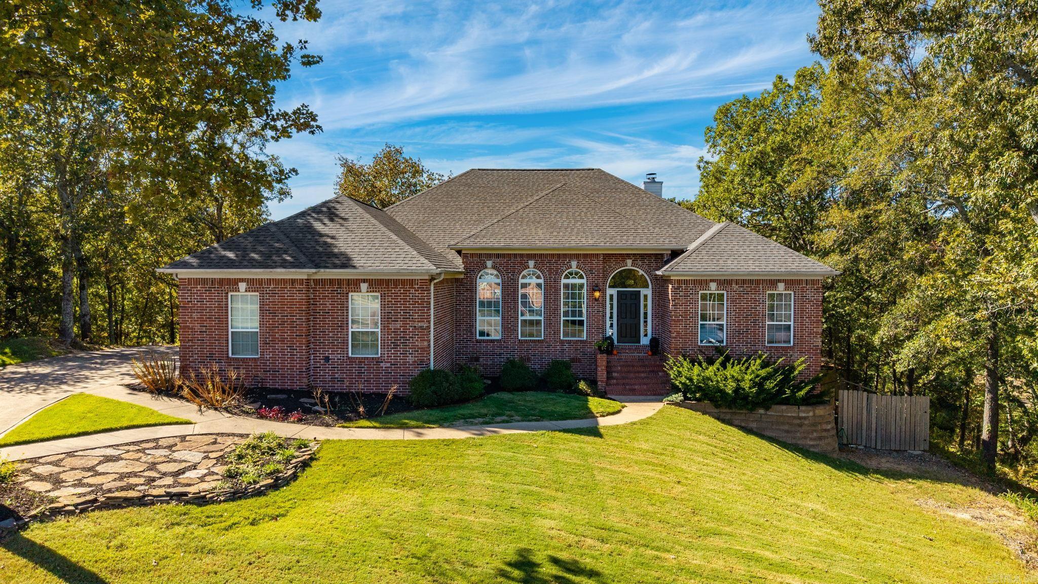 Beautiful home situated on a quiet cul-de-sac in the desirable Summerwood Addition. This 3,600 sq. ft. property sits on one acre offering wooded privacy, a spacious two-tiered deck, and a large L-shaped poolāperfect for outdoor entertaining. The main level features three bedrooms including the primary suite, while the lower level offers a full bath, wet bar, storage, a bedroom/office space, and a living area with concrete floorsāideal for gatherings or guests.