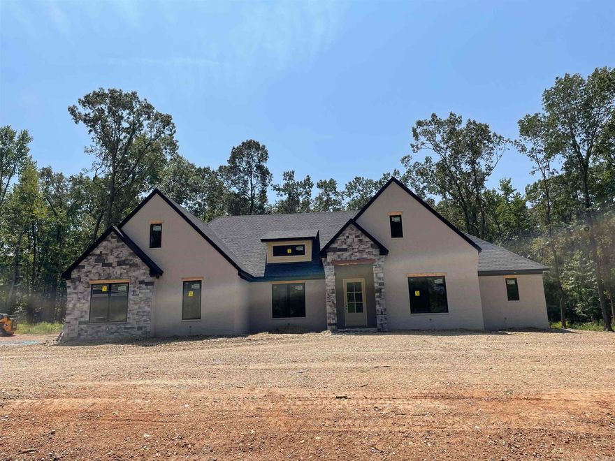 Another gorgeous custom home by Homes by Hesley. This is a one level split floor plan with oversized kitchen. Huge primary suite and connecting laundry. The wooded back yard is perfect to enjoy on your large covered porch with woodturning fireplace.