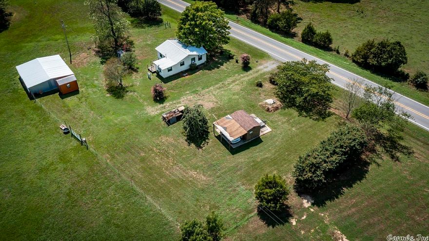 FARMHOUSE ON APPROX. 4.35 ACRES THAT IS FENCED WITH GORGEOUS WELL MAINTAINED PASTURE AND PERFECT FOR HORSES OR COWS! BARN HAS A TACK  AND STALL AREA, SHOPS, STORM SHELTER, THIS PLACE HAS IT ALL! SIT ON YOUR FRONT OR BACK PORCH AND ENJOY THE VIEWS AND PEACEFUL SCENERY.