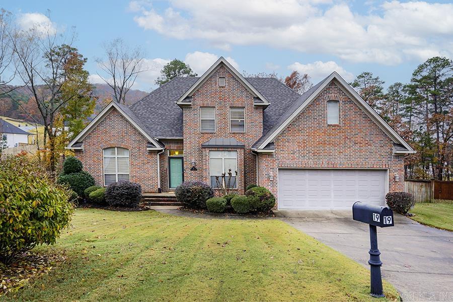 Spectacular and spacious home nestled at the end of a peaceful cul-de-sac in the highly sought-after Challain Place in Chenal Valley, close to the neighborhood pool and playground. This gorgeous home features vaulted ceilings and a wall of windows that flood the living space with natural light. Main level has master suite with spa inspired bath, including double vanities, jetted tub, large walk-in closet, as well as a half bath for guests. Upstairs are three additional bedrooms and a full bath. Downstairs bonus space with full bath is perfect for office, game room, or movie room. Chef's kitchen is equipped with nice granite countertops, stainless steel appliances, and breakfast bar. Adjacent breakfast room has french doors opening to deck overlooking wonderful large fully fenced-in backyard with patio and garden beds. Recent updates include a new roof (2023), one new HVAC unit (2024), new compressor for the other unit (2024). With beautiful hardwood floors on the main level and brand new carpet (2024) upstairs, this home is perfect for family living and entertaining.