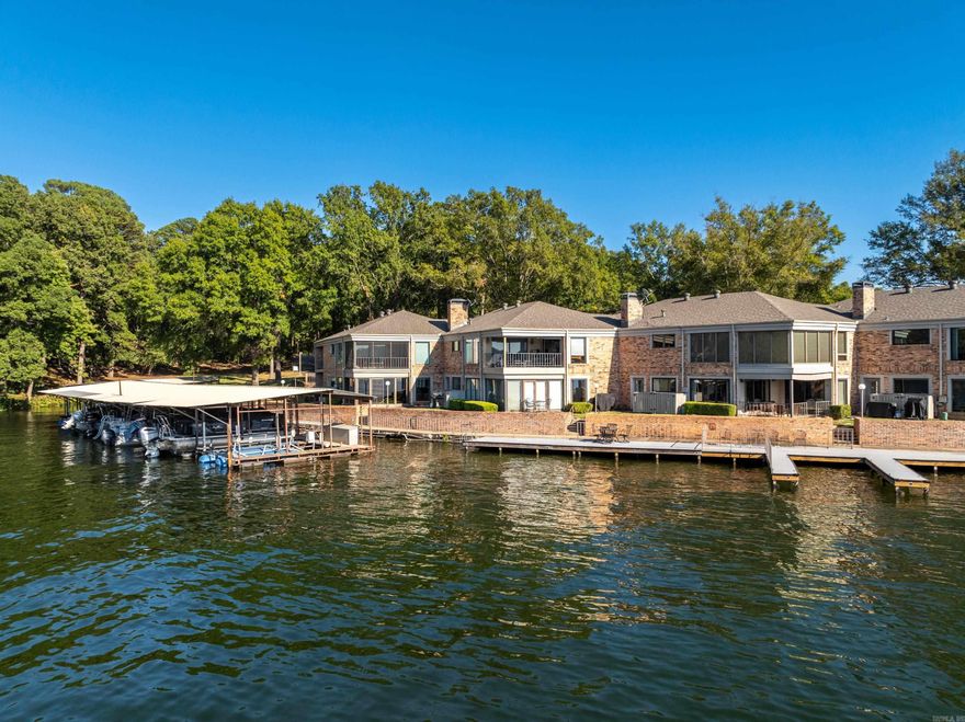 WELL APPOINTED CONDO RIGHT ON THE WATER in the GATED community of SCULLY POINT! Welcome to your weekend retreat on beautiful Lake Hamilton. Relax on the waters edge while enjoying the AMAZING VIEWS from this FURNISHED 3 bedroom 2 bath condo. BOAT SLIP WITH NEW LIFT INCLUDED. Watch the boats go by from the large patio or boardwalk in this 1,638 sq ft condo that includes refrigerator as well as a 1 year home warranty. Lots of floor-to-ceiling windows to maximize the views. Convenient location close to everything - minutes to Oaklawn Racing Casino Resort, downtown Hot Springs and Bath House Row as well as shopping & restaurants. This one is a must see!